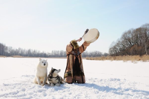 Man with wolf playin drum